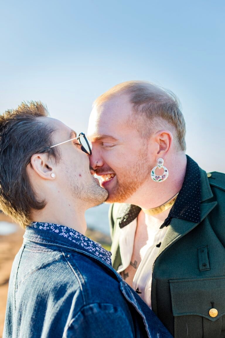 A queer couple kissing on Lake Heftner