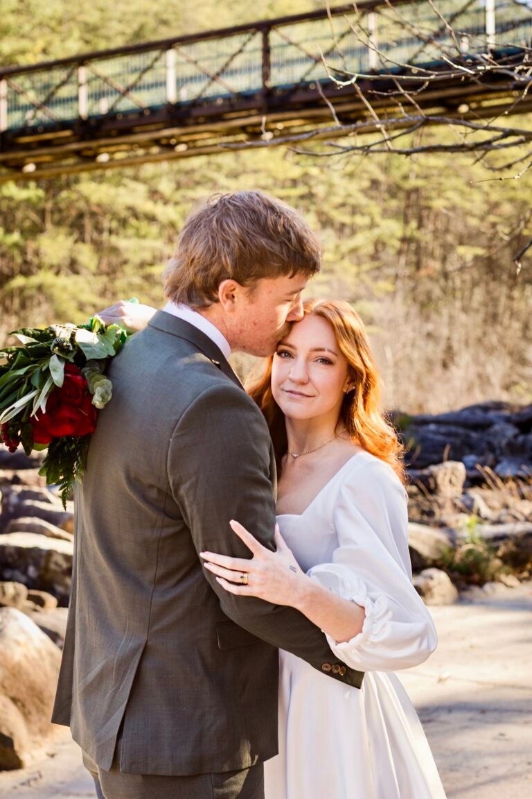 A bride and groom on their elopement day in Cherokee National forest at the Olympic Bridge
